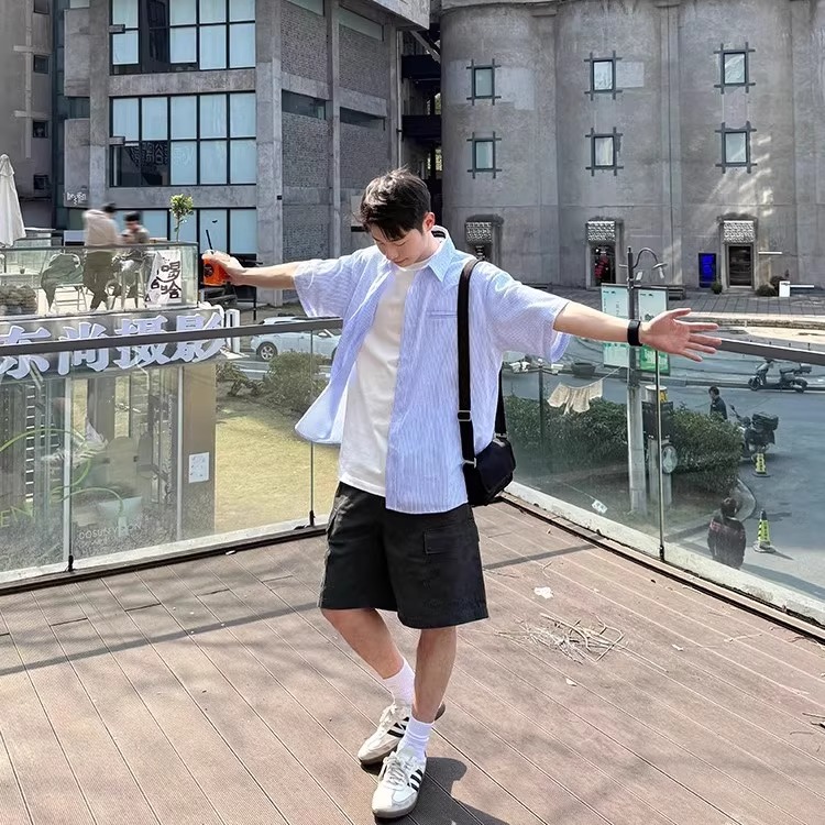 Men's Short-Sleeve Casual Shirt - Trendy Summer Jacket in Loose Fit, Stylish Hong Kong Design for Effortless Fashion Men's Short-Sleeve Casual Shirt - Trendy Summer Jacket in Loose Fit, Stylish Hong Kong Design for Effortless Fashion