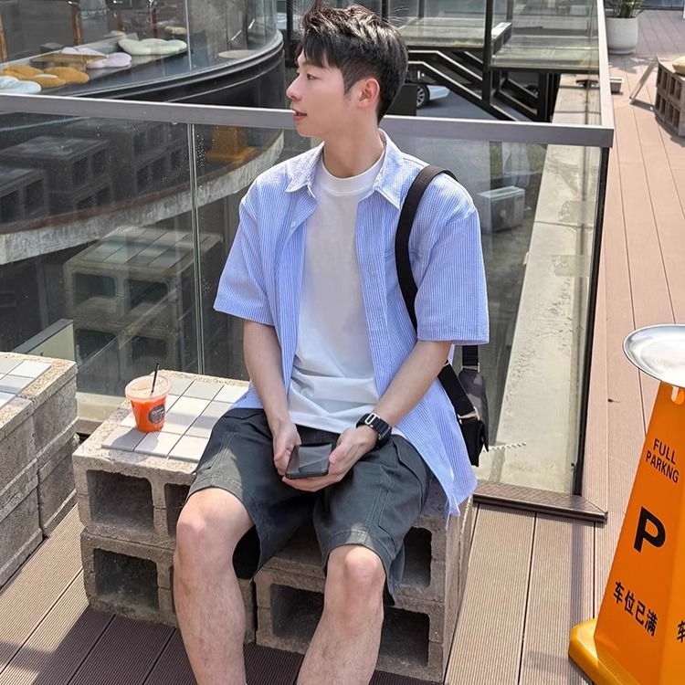 Men's Short-Sleeve Casual Shirt - Trendy Summer Jacket in Loose Fit, Stylish Hong Kong Design for Effortless Fashion Men's Short-Sleeve Casual Shirt - Trendy Summer Jacket in Loose Fit, Stylish Hong Kong Design for Effortless Fashion