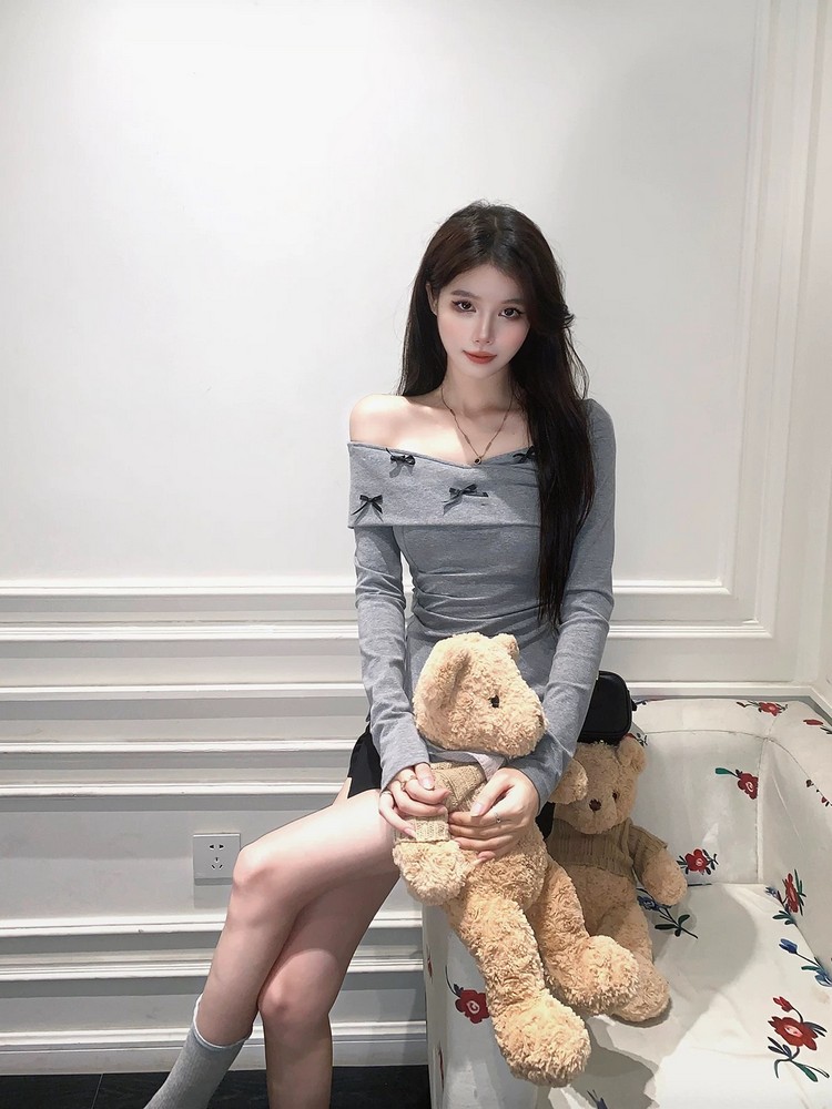 Off-Shoulder Bow Tie Top and Slim Fit Short Skirt Set for Women - Sweet and Spicy Spring Fashion with Long Sleeves Off-Shoulder Bow Tie Top and Slim Fit Short Skirt Set for Women - Sweet and Spicy Spring Fashion with Long Sleeves