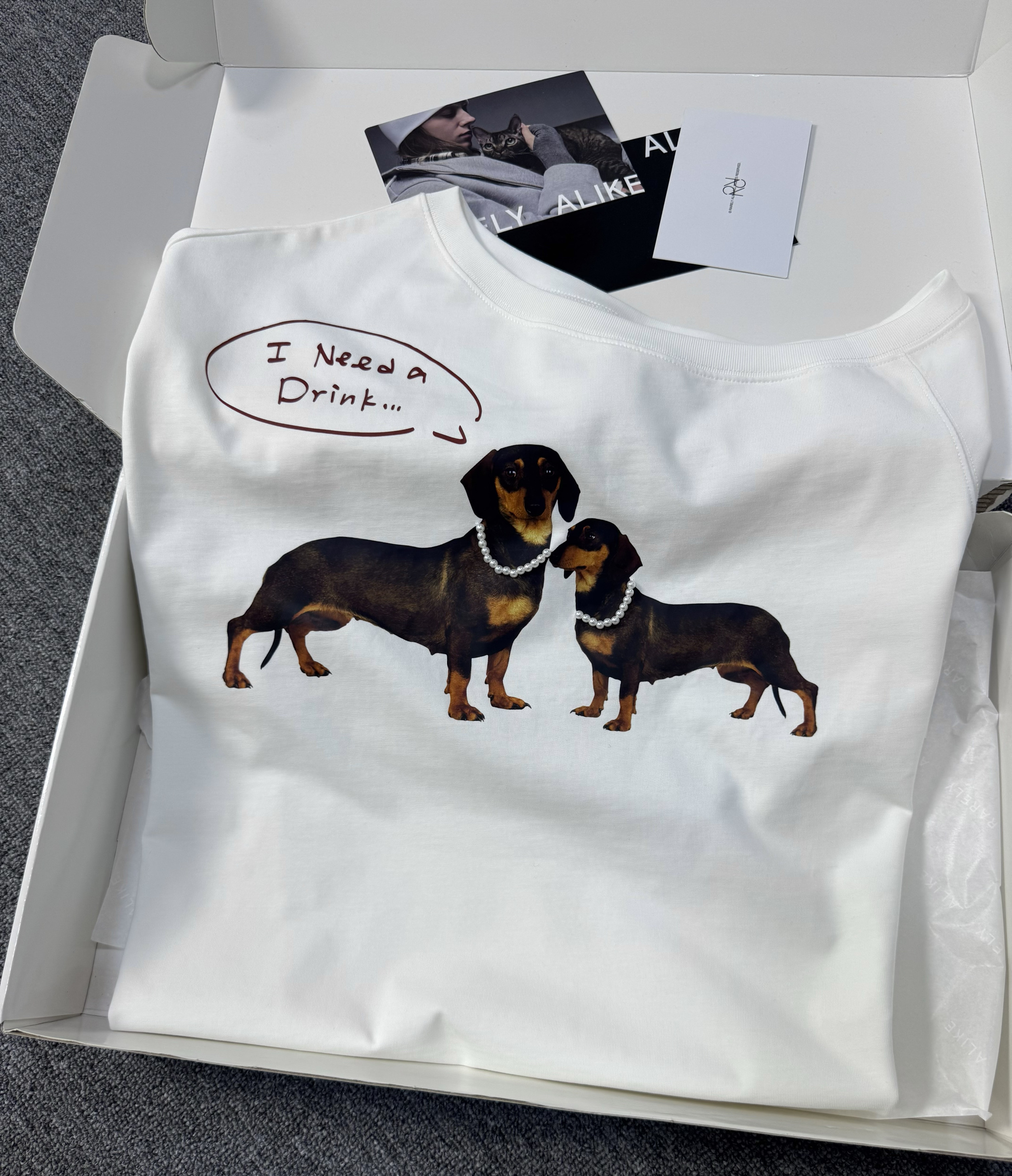 Summer White Off-Shoulder Sausage Dog T-Shirt - Slimming Short Sleeve Top, 90s Inspired, Versatile Casual Fashion Summer White Off-Shoulder Sausage Dog T-Shirt - Slimming Short Sleeve Top, 90s Inspired, Versatile Casual Fashion