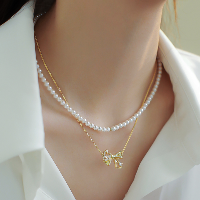 Trendy Double-Layer Bow Pendant Pearl Necklace for Women - Elegant Niche Design Clavicle Chain 2025