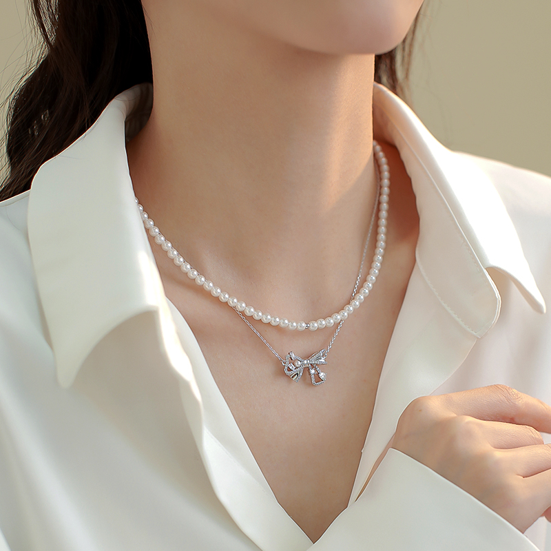 Trendy Double-Layer Bow Pendant Pearl Necklace for Women - Elegant Niche Design Clavicle Chain 2025 Trendy Double-Layer Bow Pendant Pearl Necklace for Women - Elegant Niche Design Clavicle Chain 2025