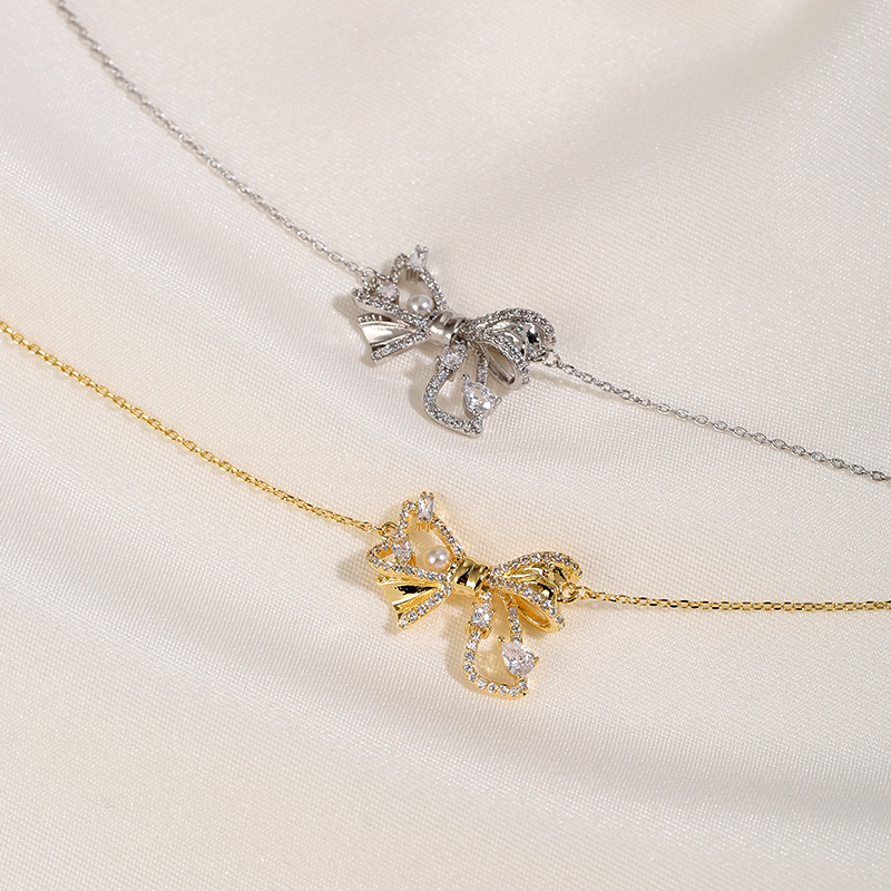 Trendy Double-Layer Bow Pendant Pearl Necklace for Women - Elegant Niche Design Clavicle Chain 2025 Trendy Double-Layer Bow Pendant Pearl Necklace for Women - Elegant Niche Design Clavicle Chain 2025