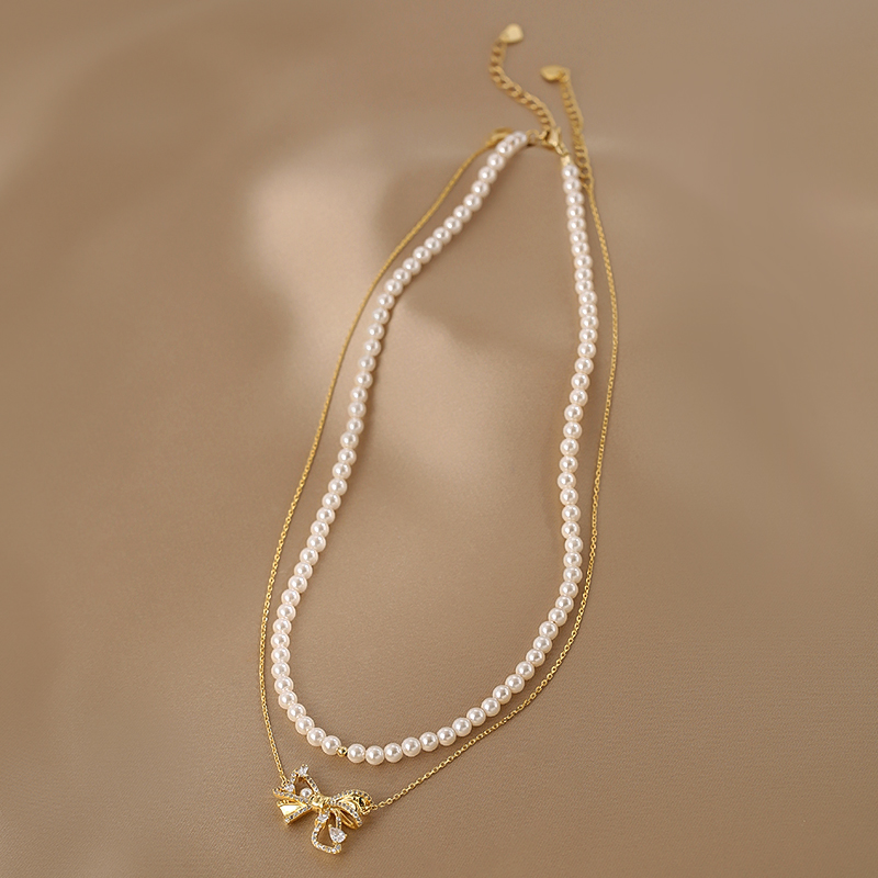 Trendy Double-Layer Bow Pendant Pearl Necklace for Women - Elegant Niche Design Clavicle Chain 2025 Trendy Double-Layer Bow Pendant Pearl Necklace for Women - Elegant Niche Design Clavicle Chain 2025